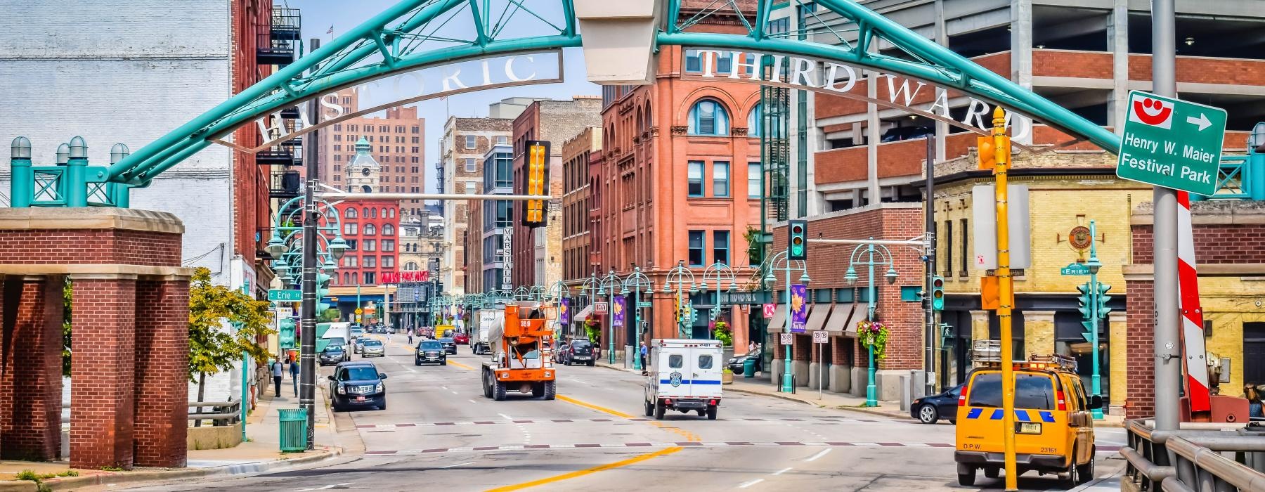 a street with cars and buildings